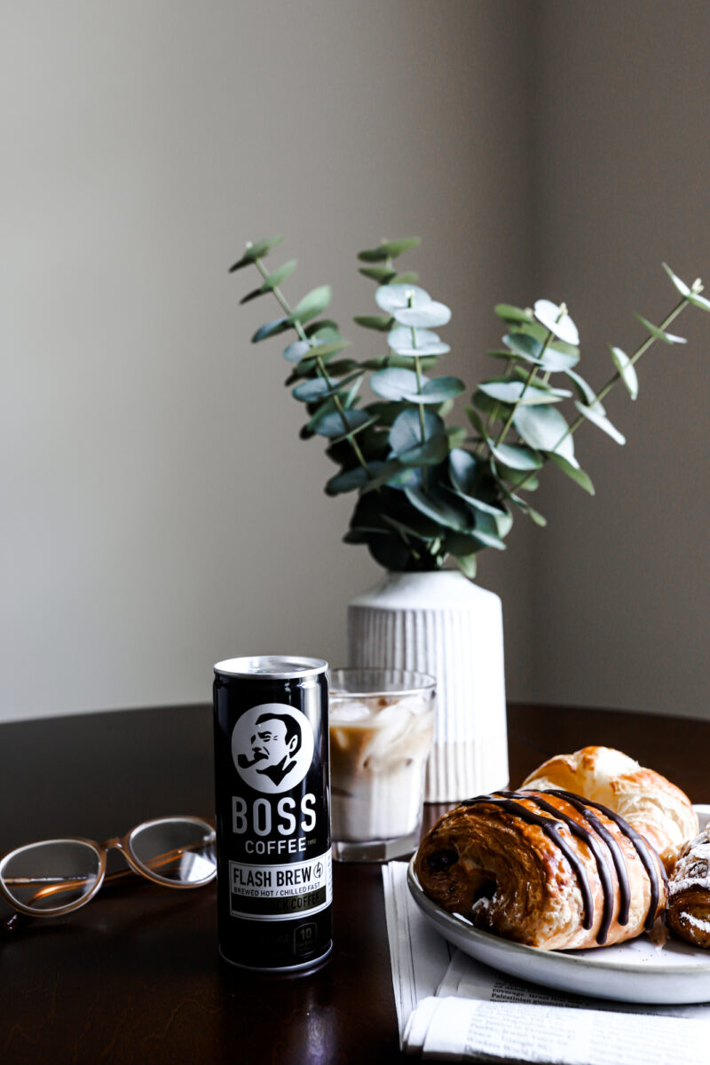 BOSS Coffee on a breakfast table with pastries and danishes.