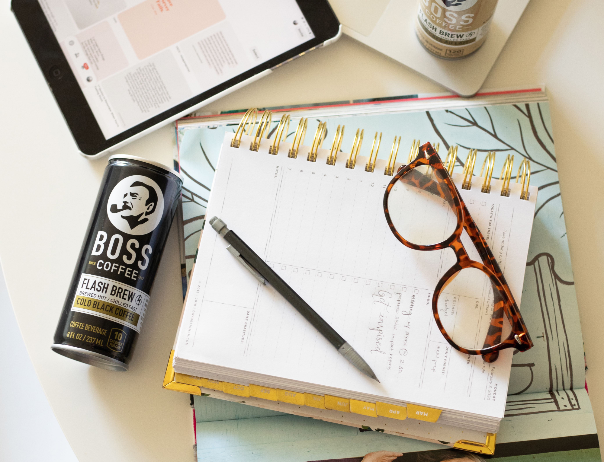 BOSS Coffee in the morning while studying and taking notes.