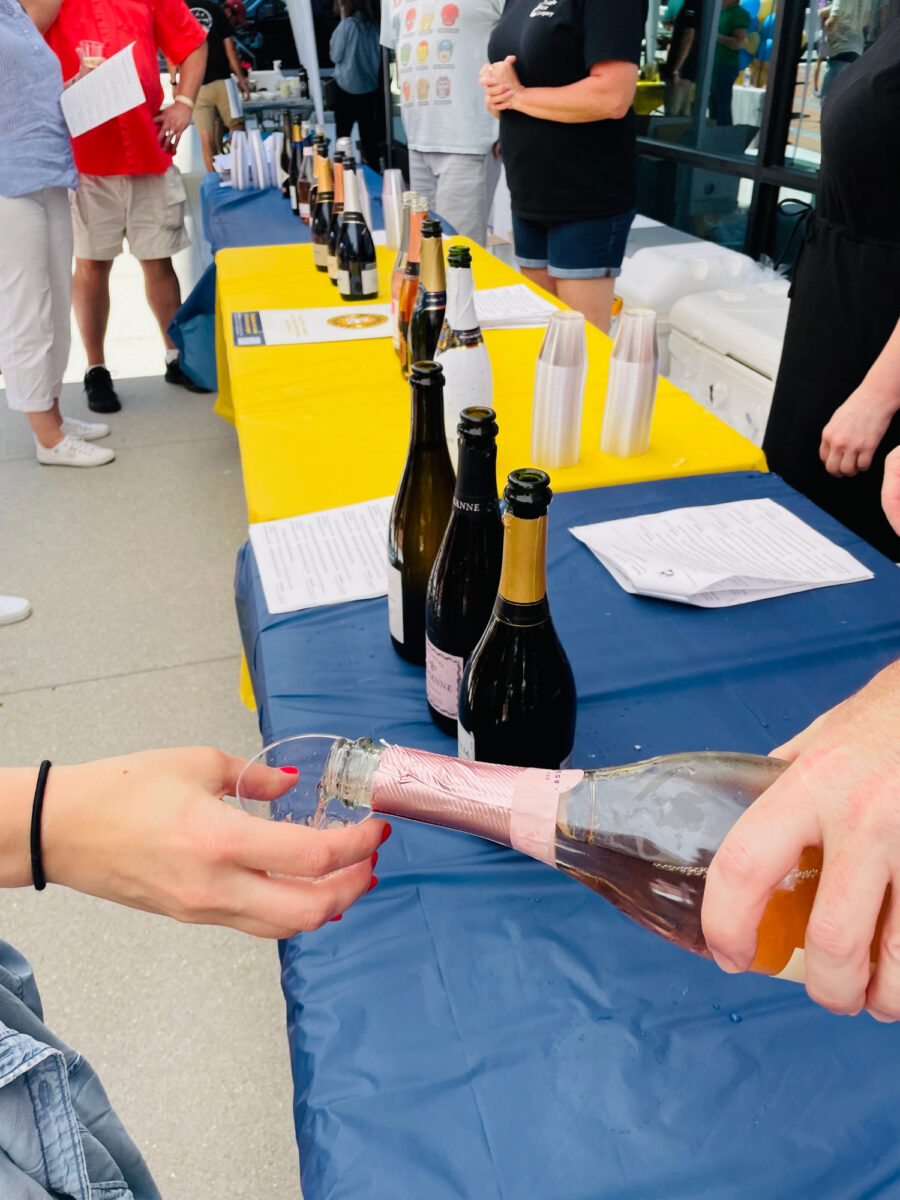 Bubbles and Brisket - 2022 Smoky Hollow in Raleigh, NC - Pouring Champagne to Attendees