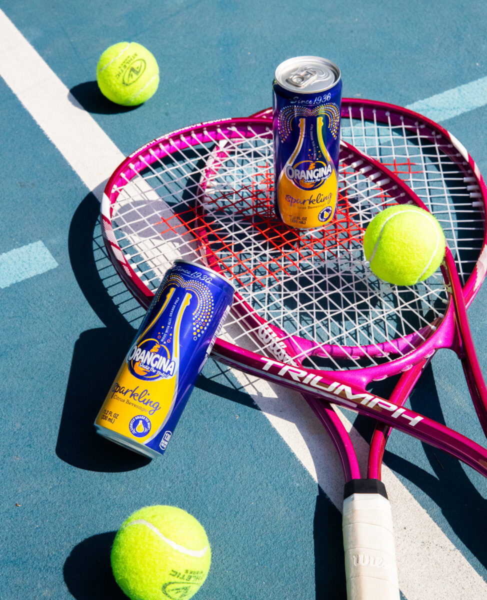 Orangina - Sparkling Can on the Tennis Court