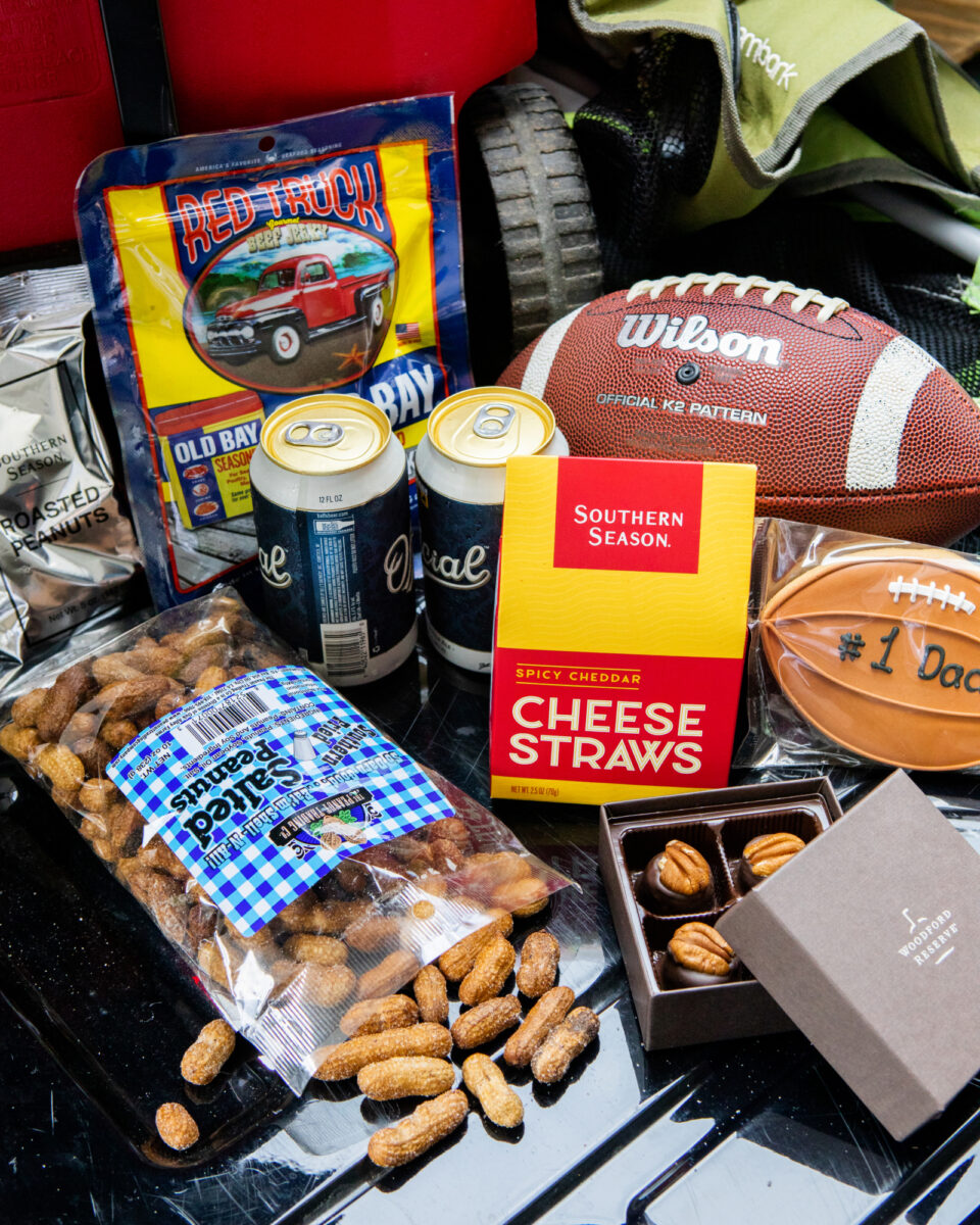 Southern Season' Fathers Day Tailgate Snack Box, including Cheese Straws, Old Bay Beef Jerky, Salted Unshelled Peanuts, Woodford Reserve Chocolate Pecans, and more