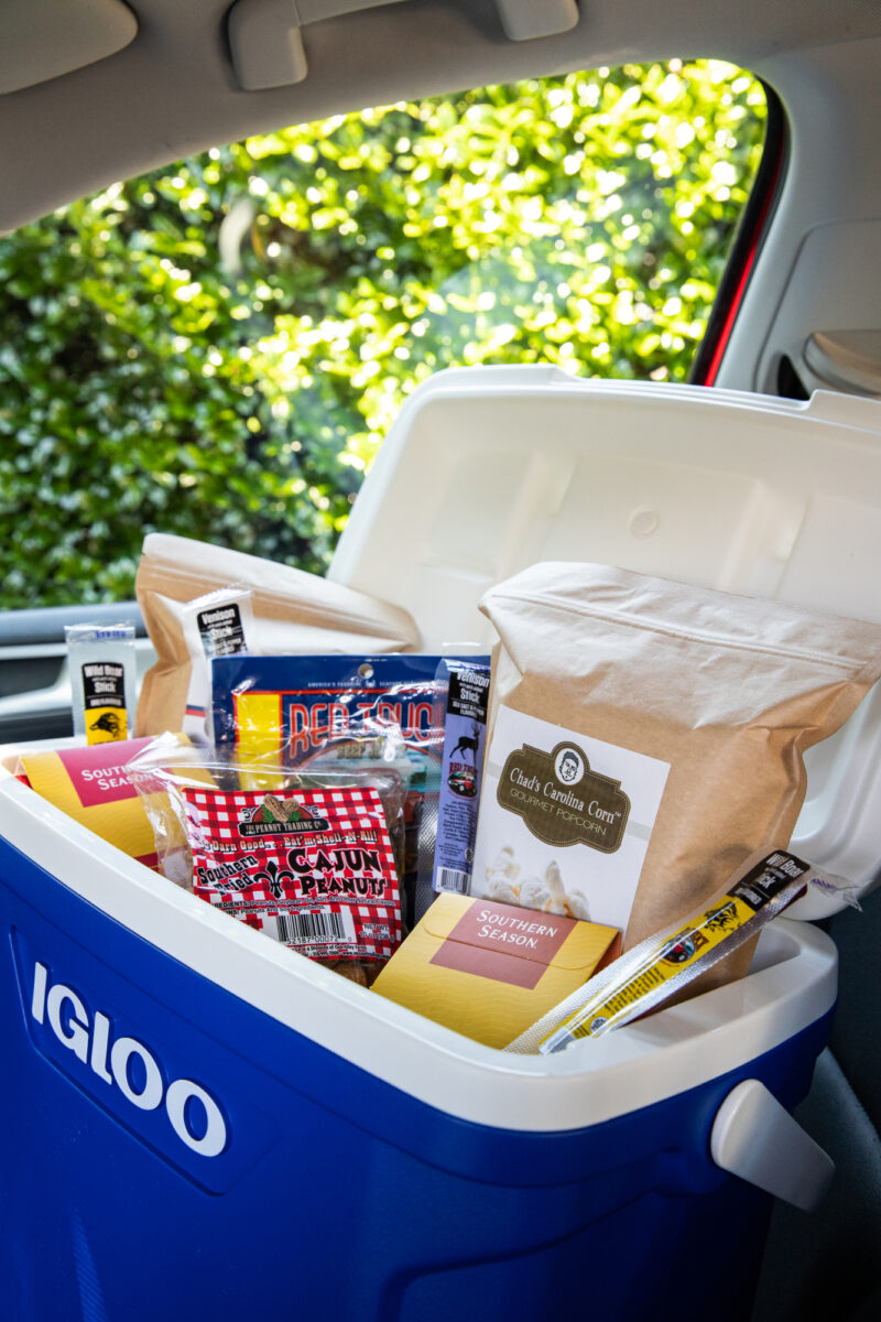 A packed Igloo cooler full of Southern Season roadtrip essentials