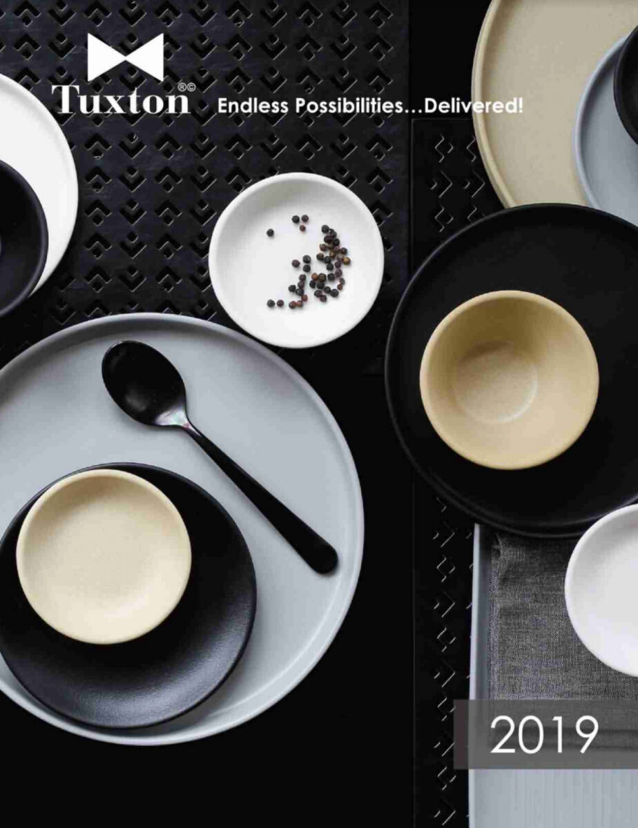 Tuxton's 2019 Catalog Cover with modern, black, white, gray and tan dinnerware