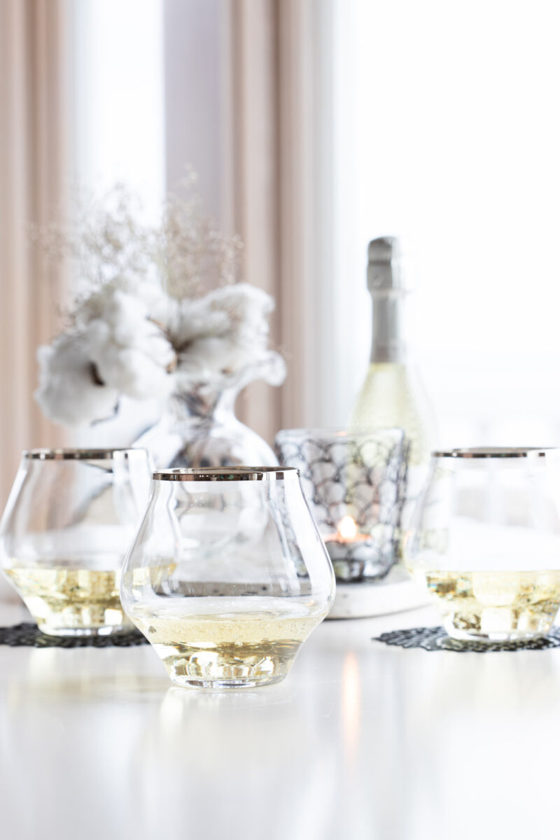 VIETRI - Metallic Rimmed Stemless Wine Glasses filled with White Wine