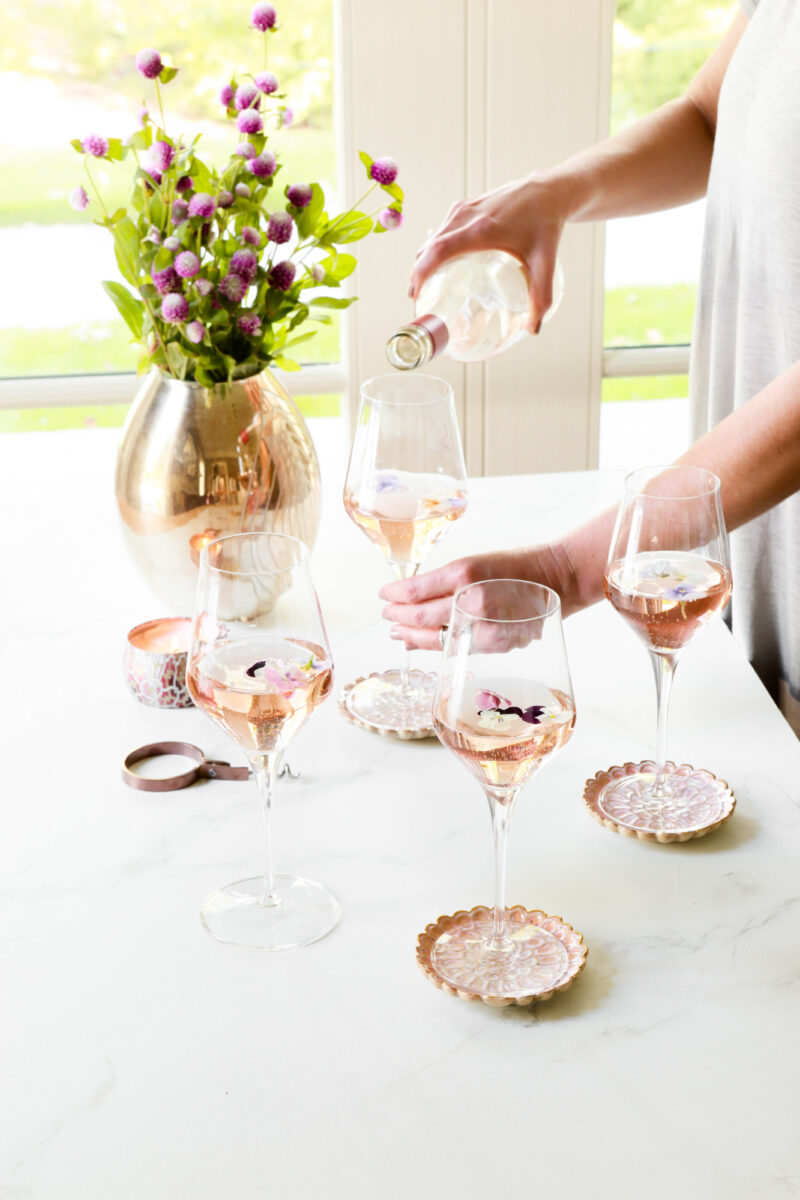 VIETRI - Pouring Rose into White Wine Glasses