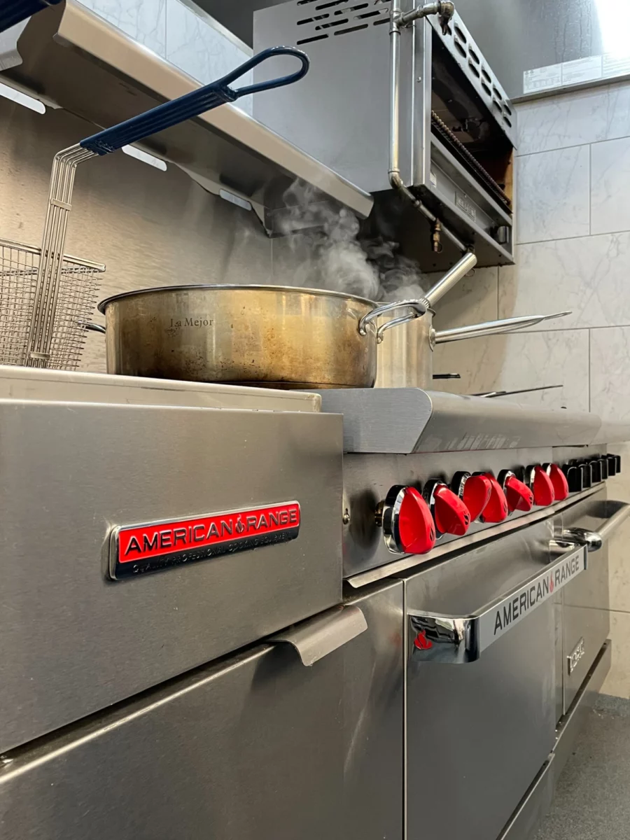 Red American Range badge on kitchen equipment